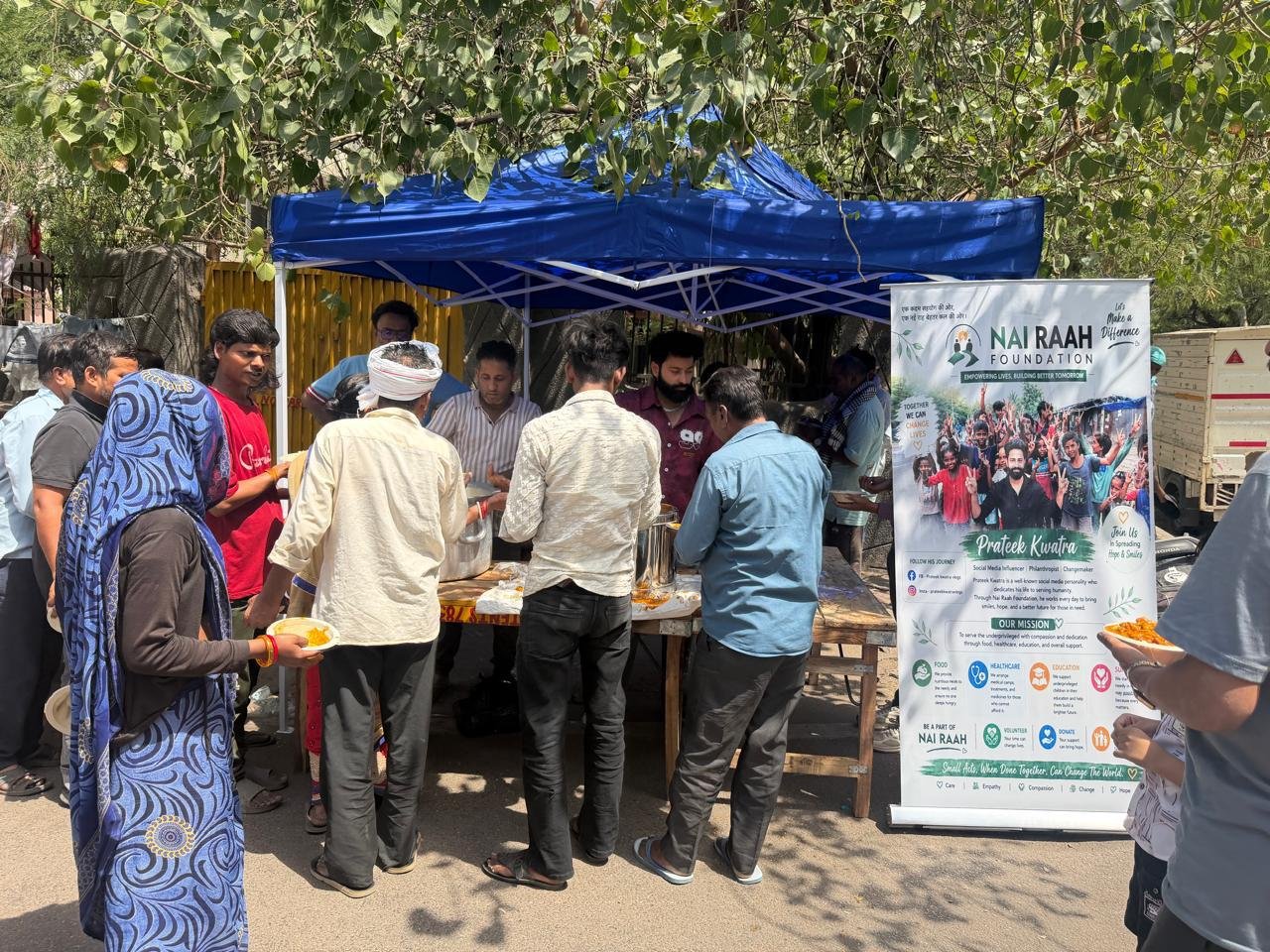 Nai Raah Foundation founder and volunteers with children and grocery relief kits